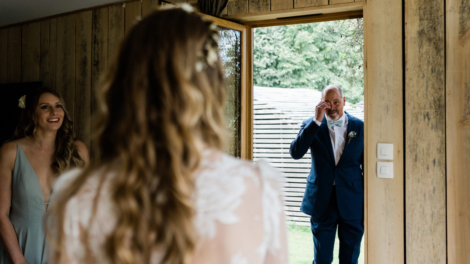 father of the bride crying first look - french american wedding at chateau du bois guy fougeres
